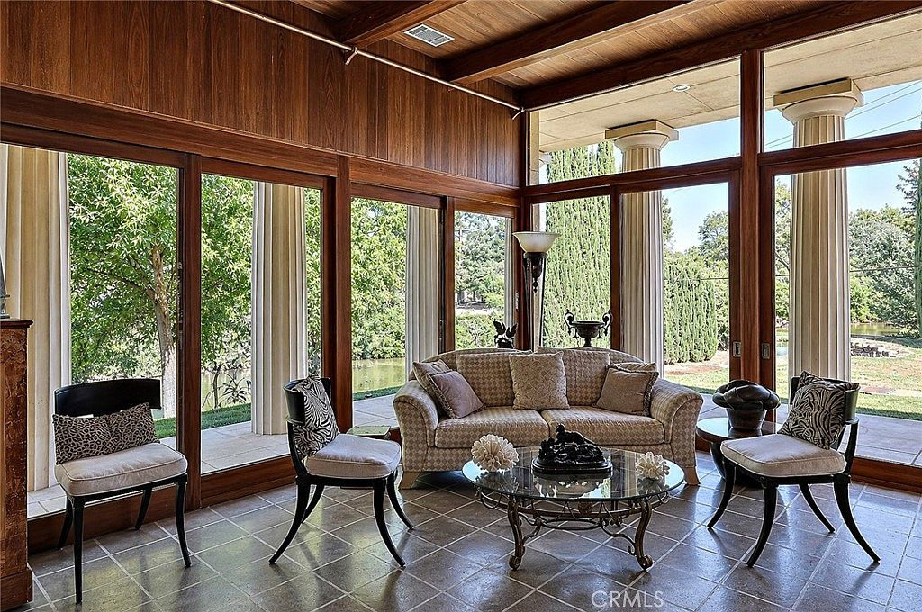 Living room with stunning creekside view through large windows