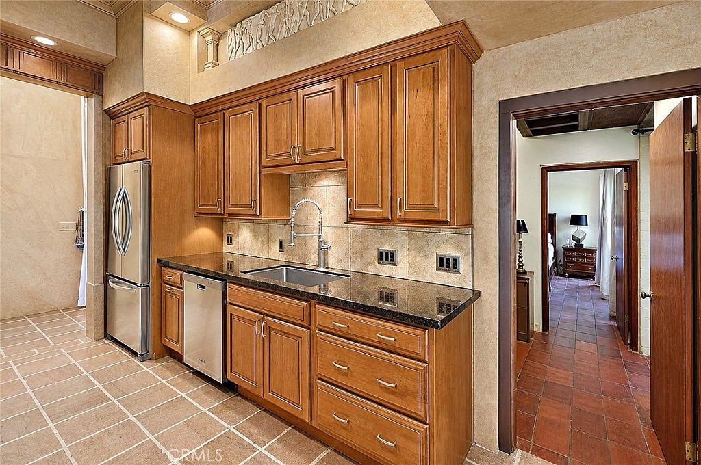 Kitchen with rich wood cabinetry and classic finishes