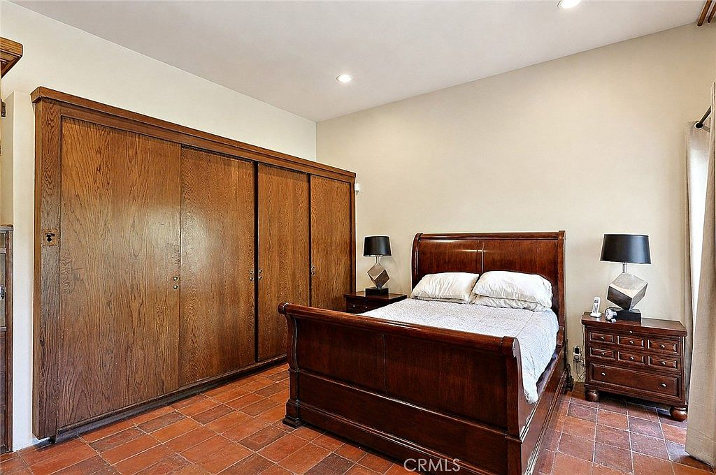 Master bedroom with built-in wood wardrobes