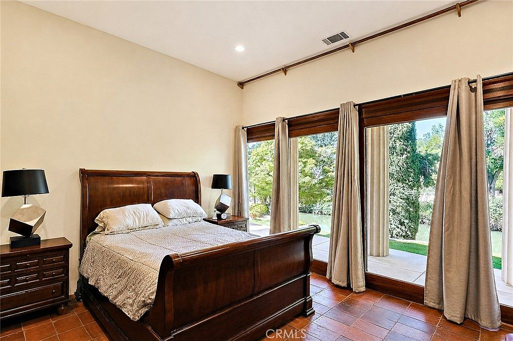 Master bedroom with creekside view through large windows
