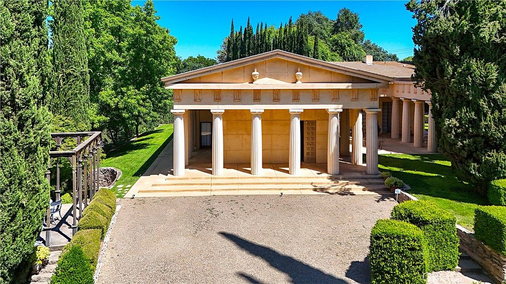 Elevated drone view of the neoclassical facade and grounds