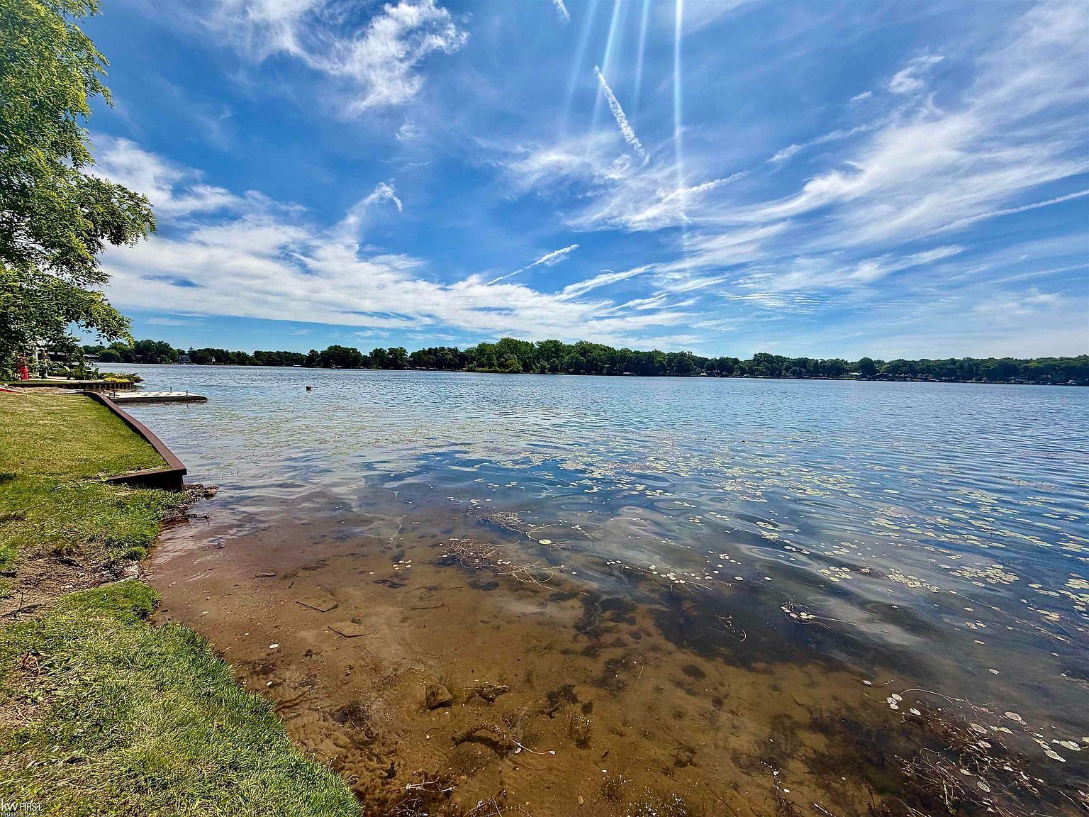 Clear shallows and shoreline grasses at the waterfront on Big Lake