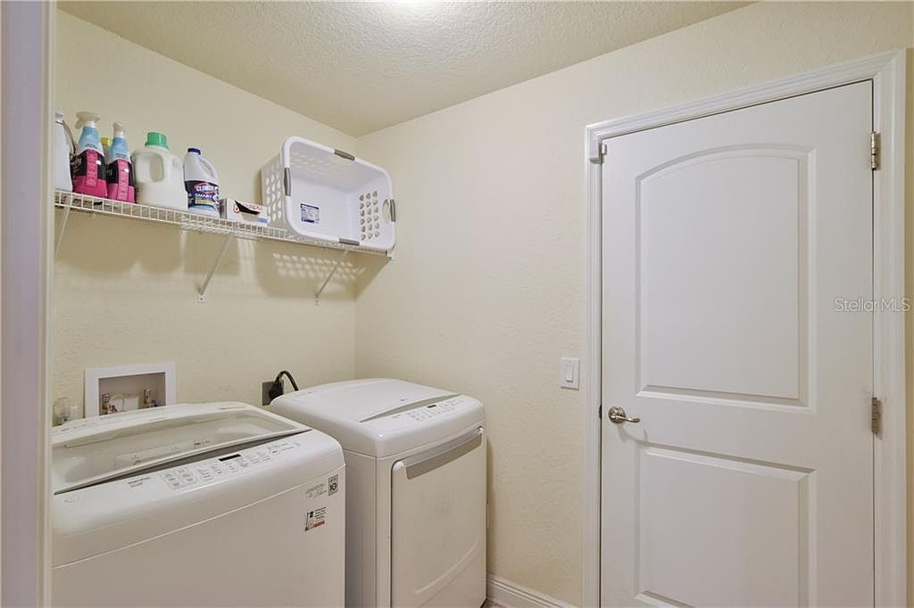 Laundry room with shelving