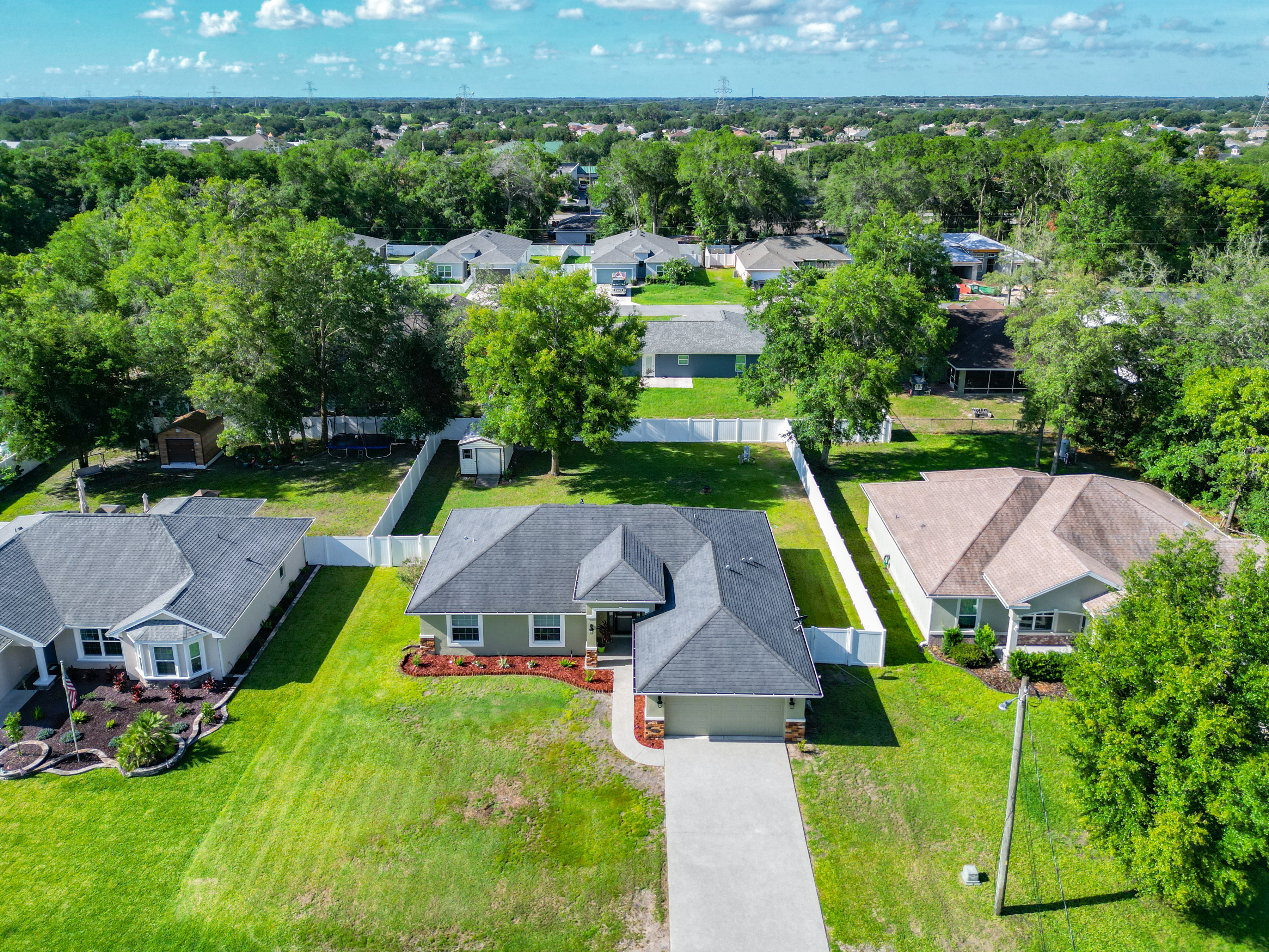 Aerial view of the property and neighborhood