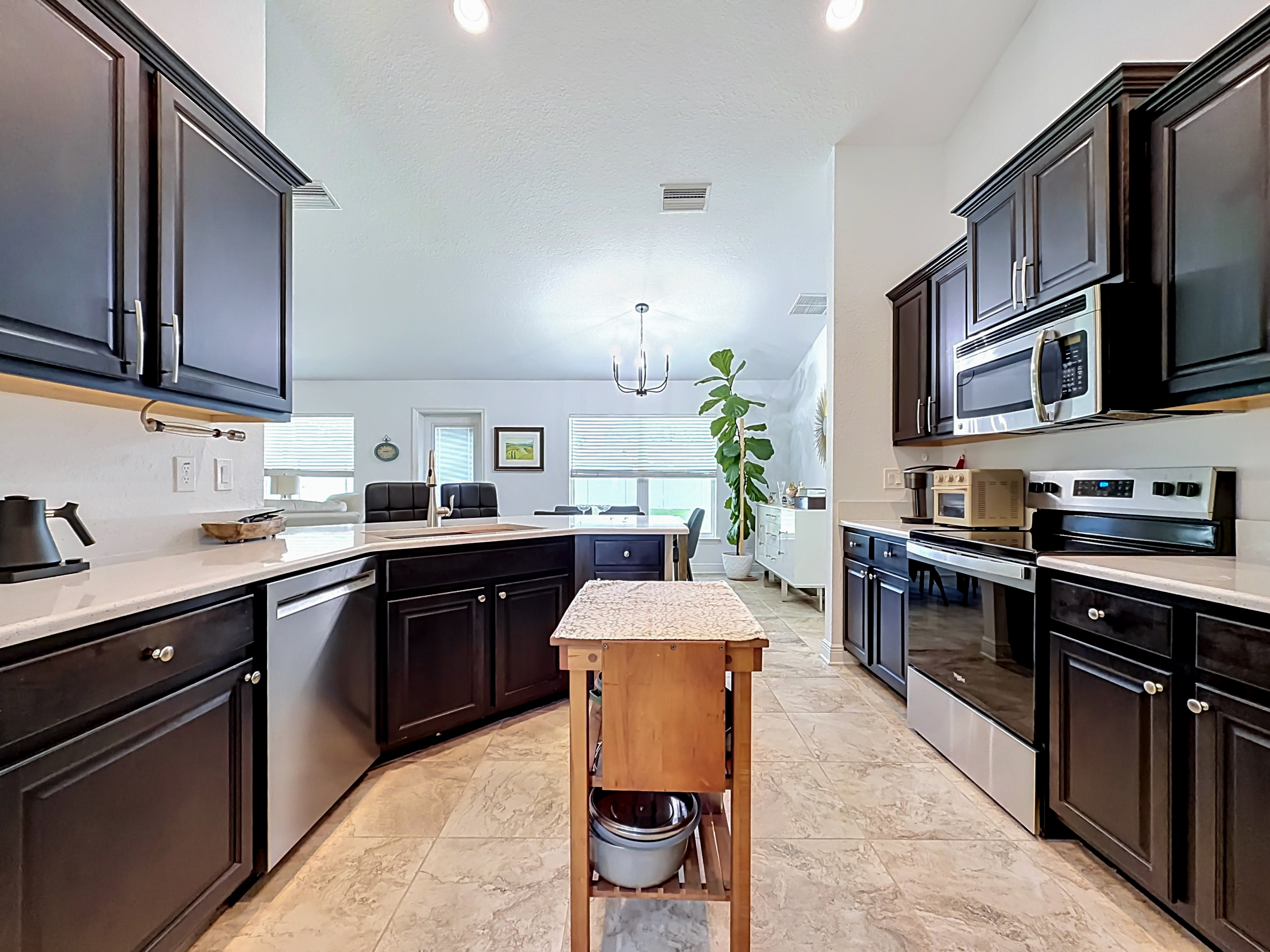 Kitchen with dark espresso cabinets and granite countertops