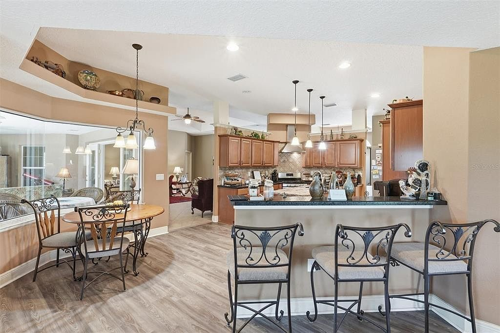 Open-concept kitchen and dining area with island seating