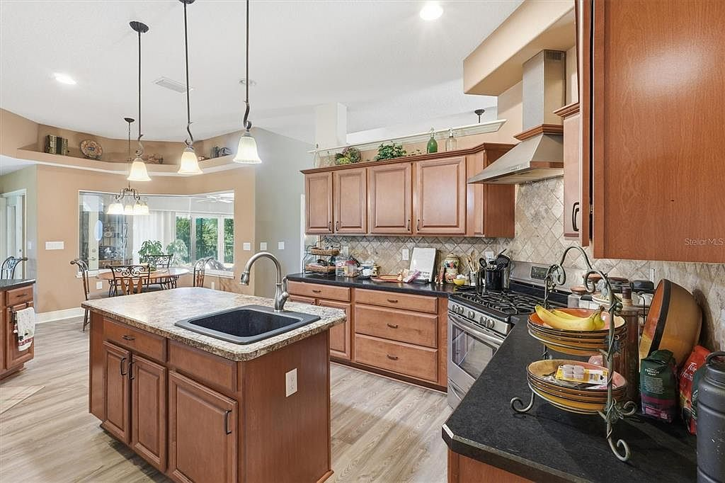 Kitchen wood cabinetry and breakfast area