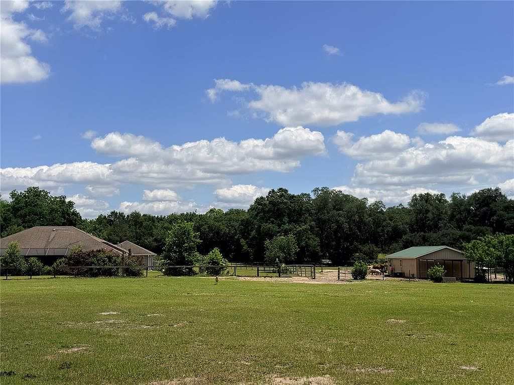 Pasture view with barn and residence