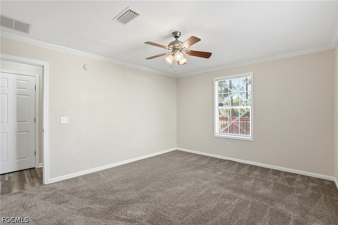 Primary bedroom with soft interior lighting and window