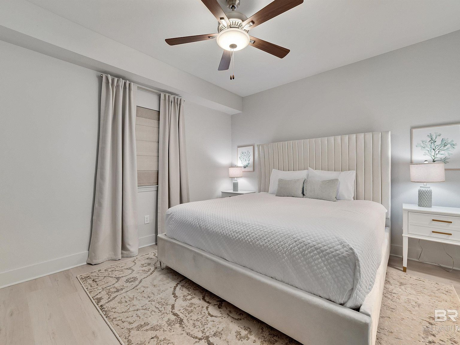 Master bedroom with king bed and coastal furnishings
