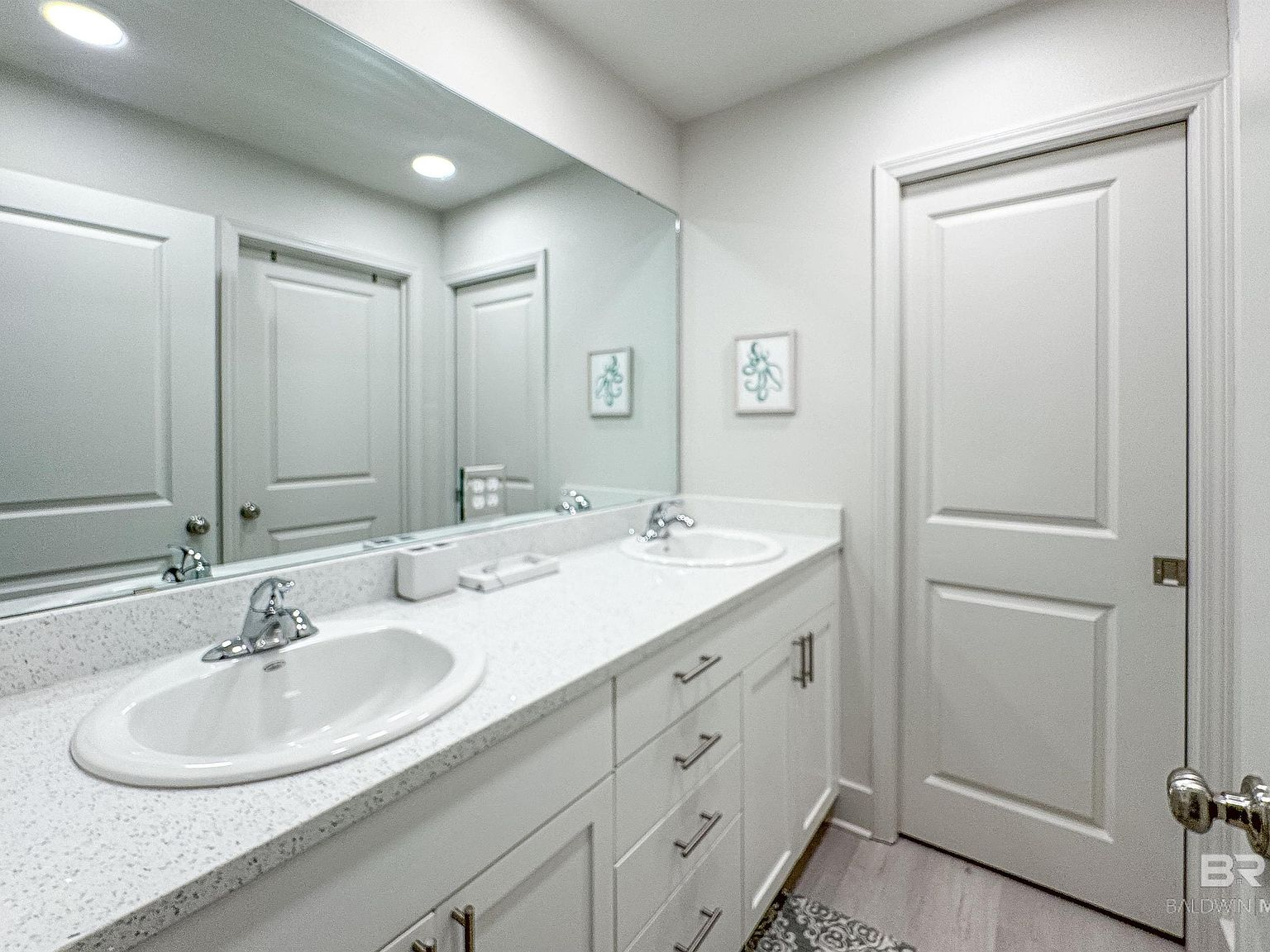 Bathroom with dual-sink quartz vanity and modern fixtures
