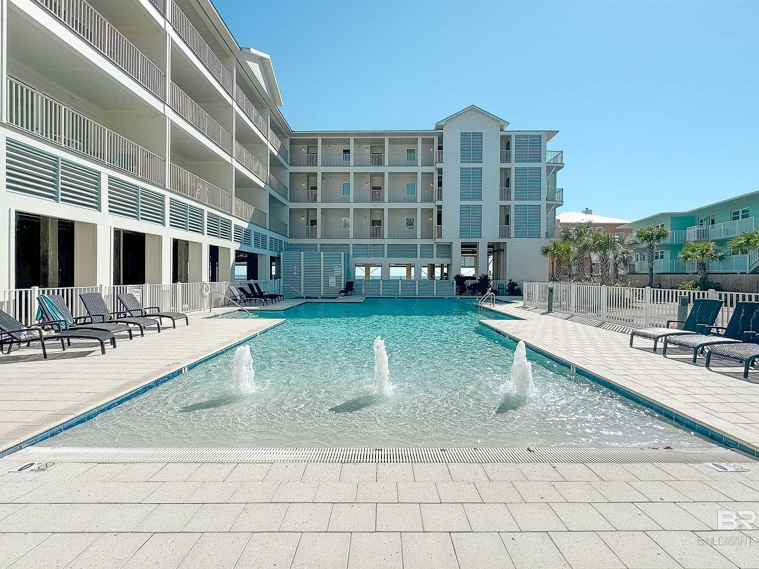 Zero-entry resort-style pool with spray fountains