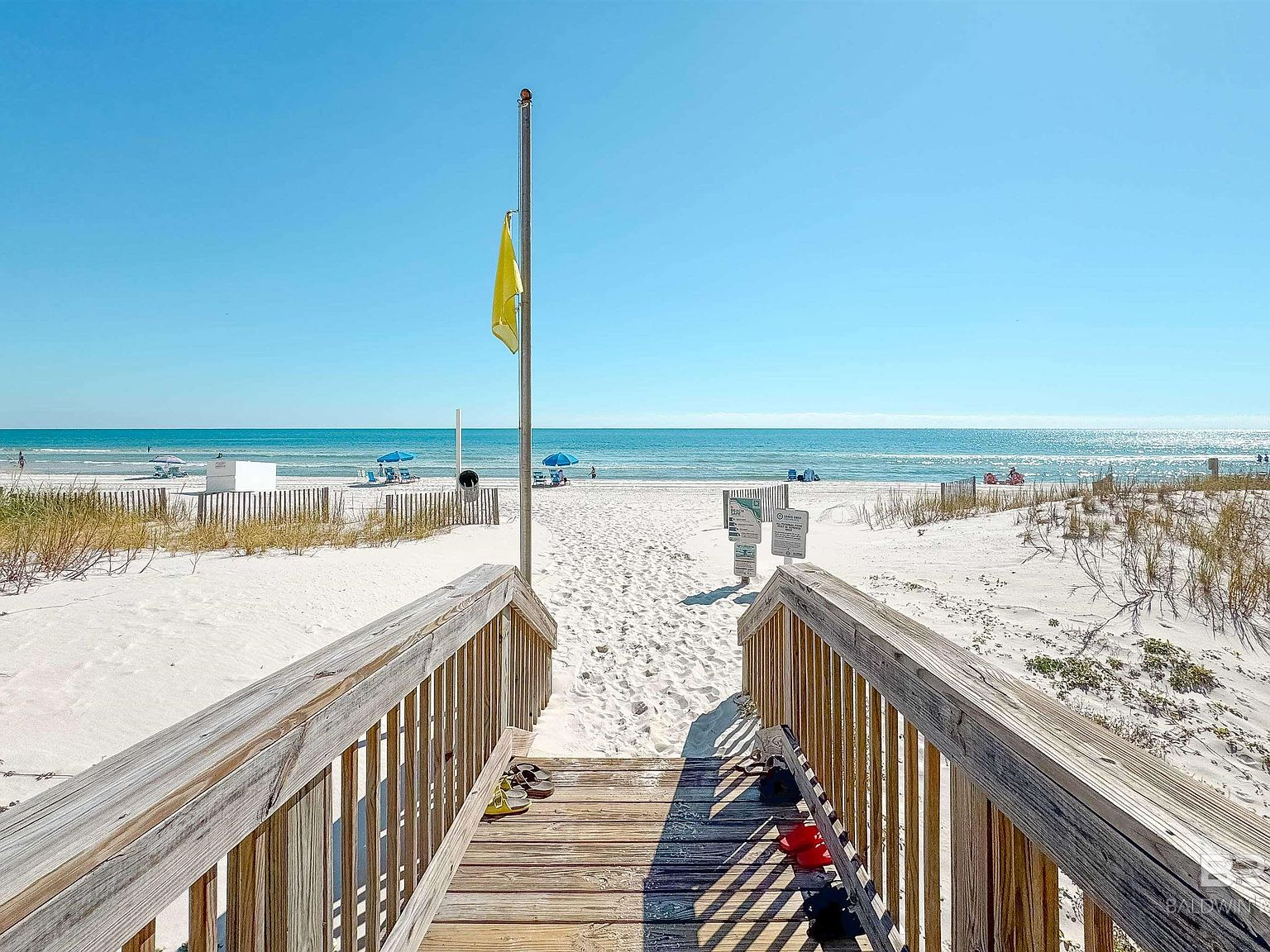 Private wooden beach walkover leading to sugar-white sand beach