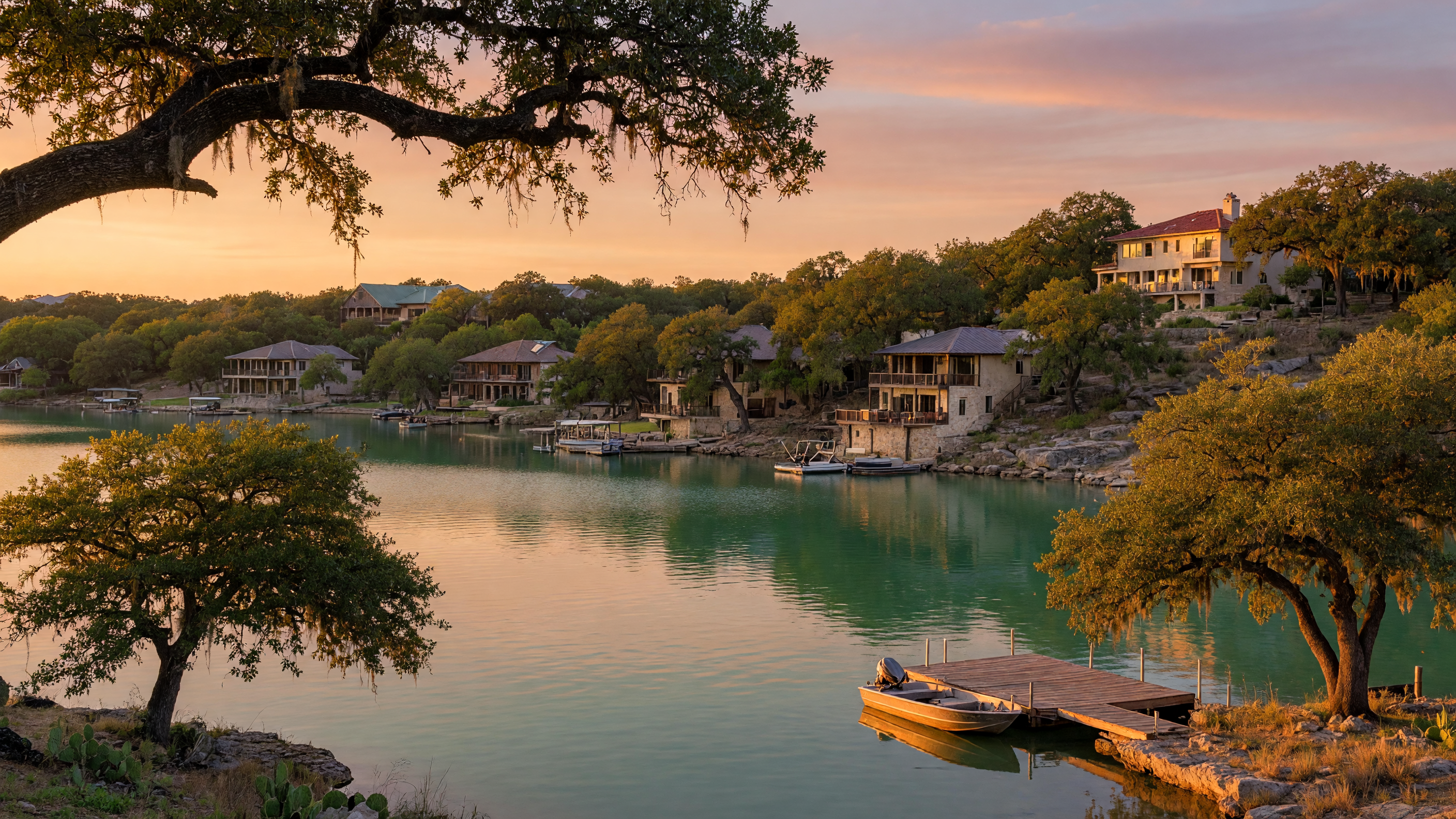 Couple reviewing home valuation documents with a real estate agent at a bright Hill Country home