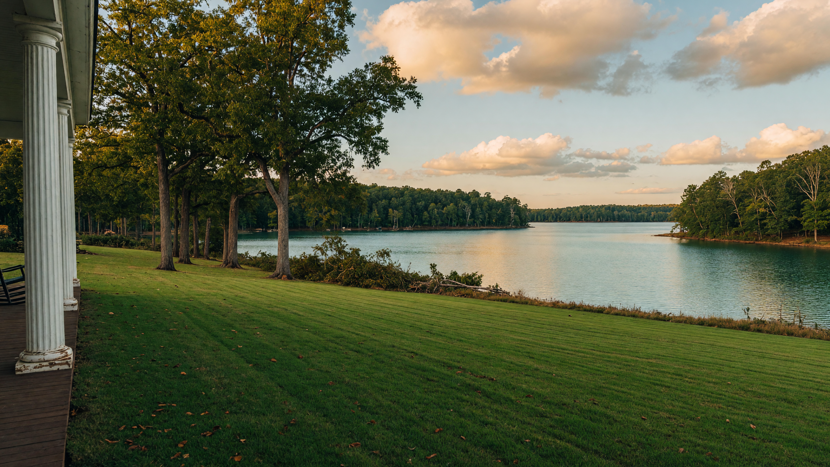 Sweeping panoramic view of Lake Hartwell from the estate grounds showing the opened sightline to the water through a cleared tree corridor