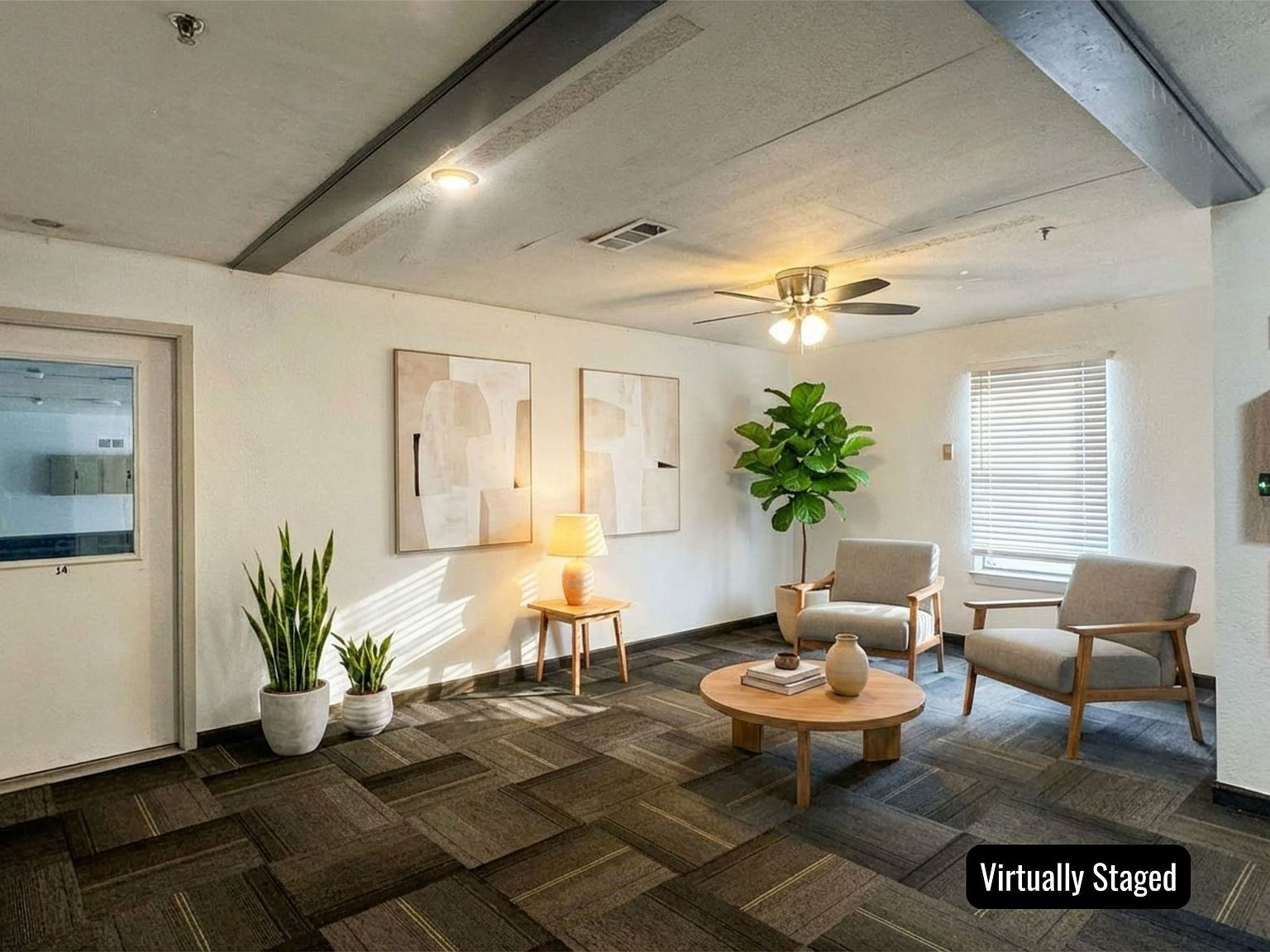 Interior flex room with patterned carpet tiles and natural light