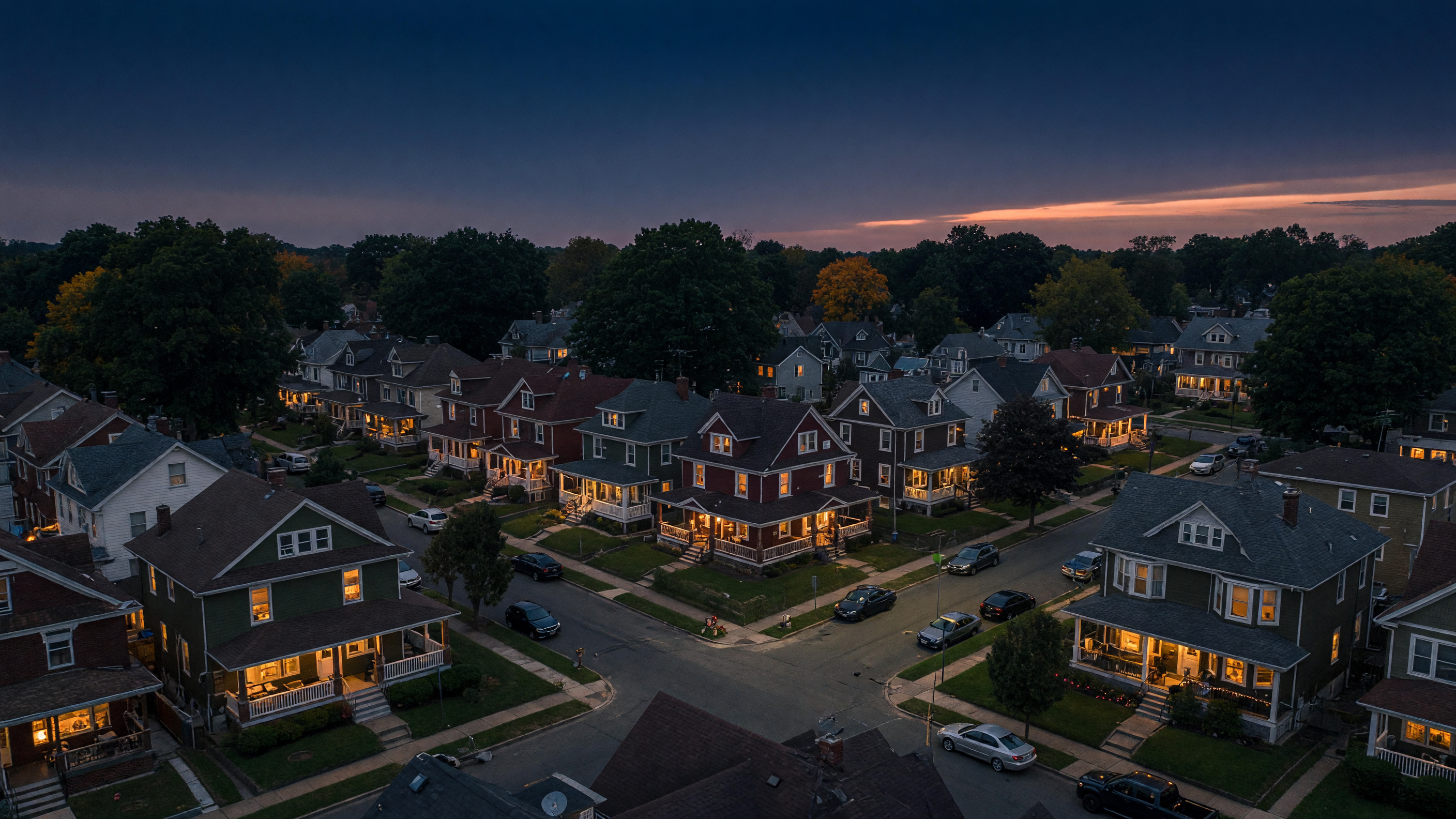 Aerial view of a North Jersey neighborhood at twilight with warm golden light