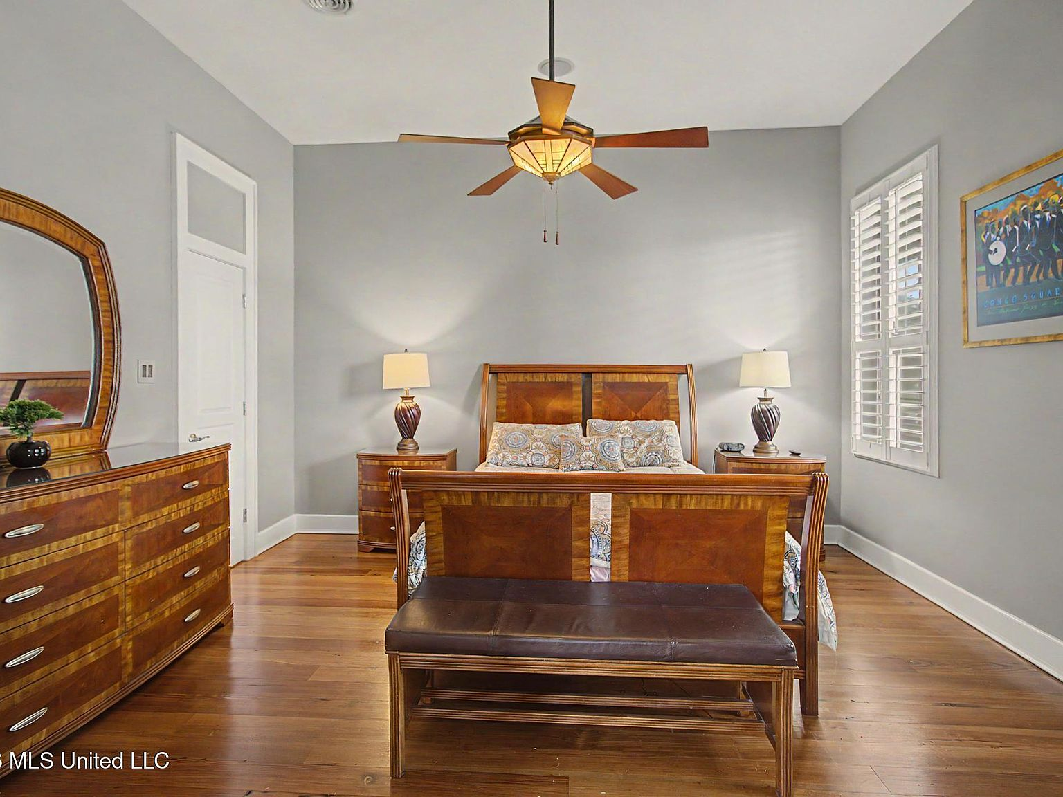 Master bedroom with high ceilings and heart pine flooring