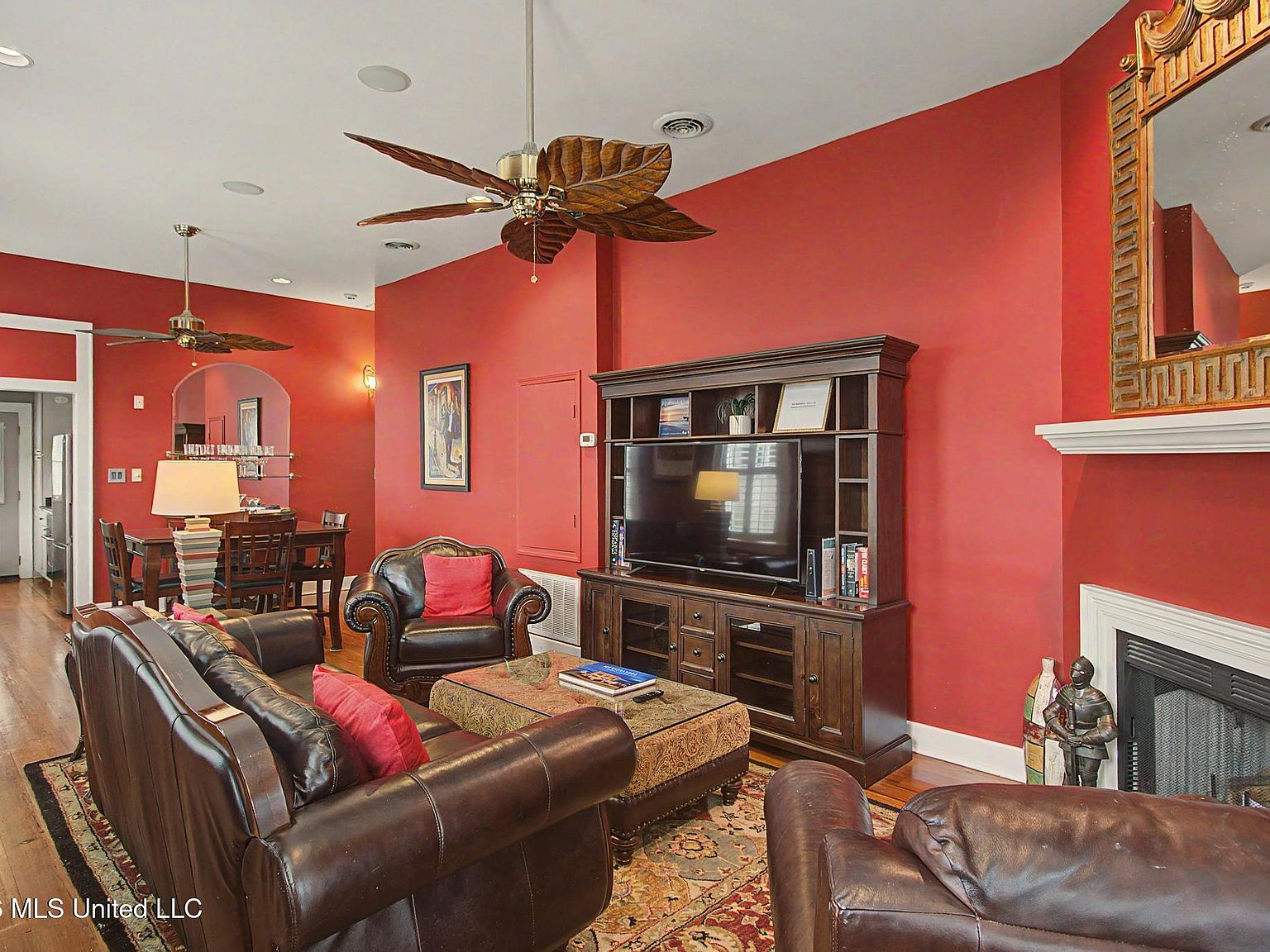 Living room with heart pine floors and shotgun-style open layout