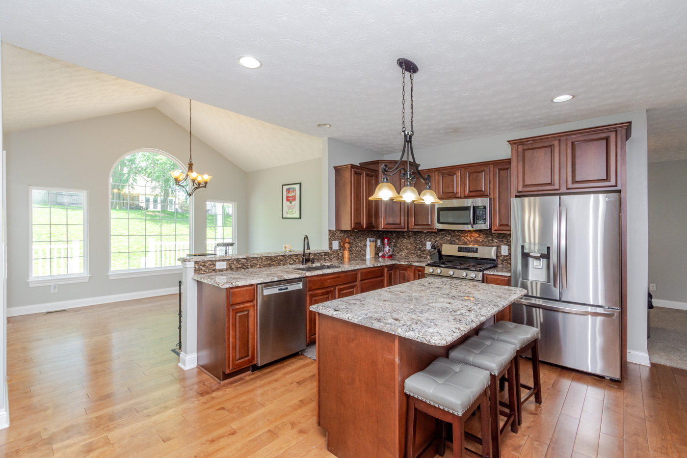 Kitchen and breakfast room with cathedral ceiling and abundant windows