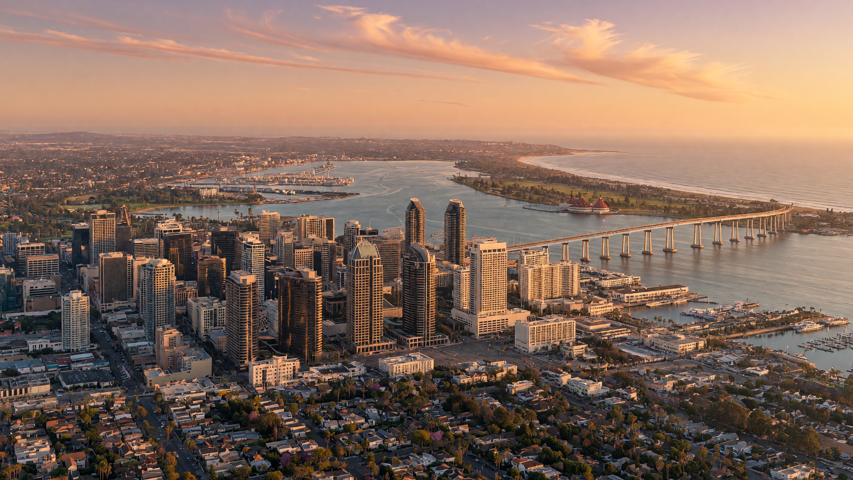 San Diego skyline at golden hour with residential neighborhoods stretching toward the Pacific Ocean