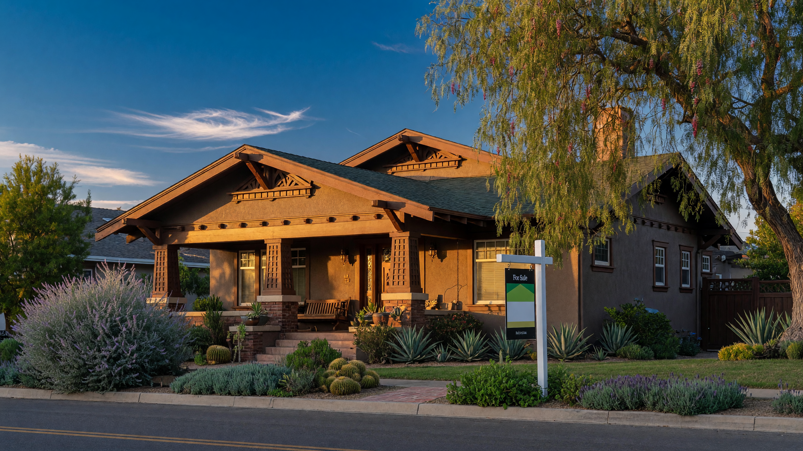 San Diego craftsman home at golden hour with a for-sale sign in the front yard