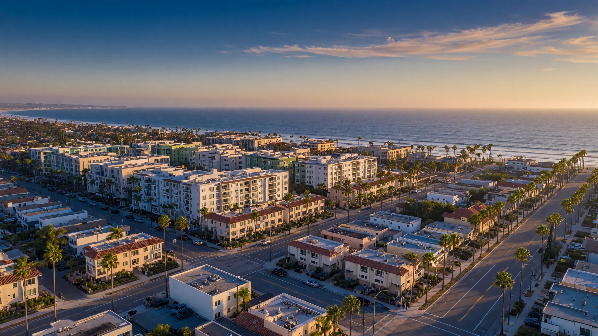 Aerial view of San Diego residential and commercial real estate at golden hour, representing investment growth and portfolio strategies