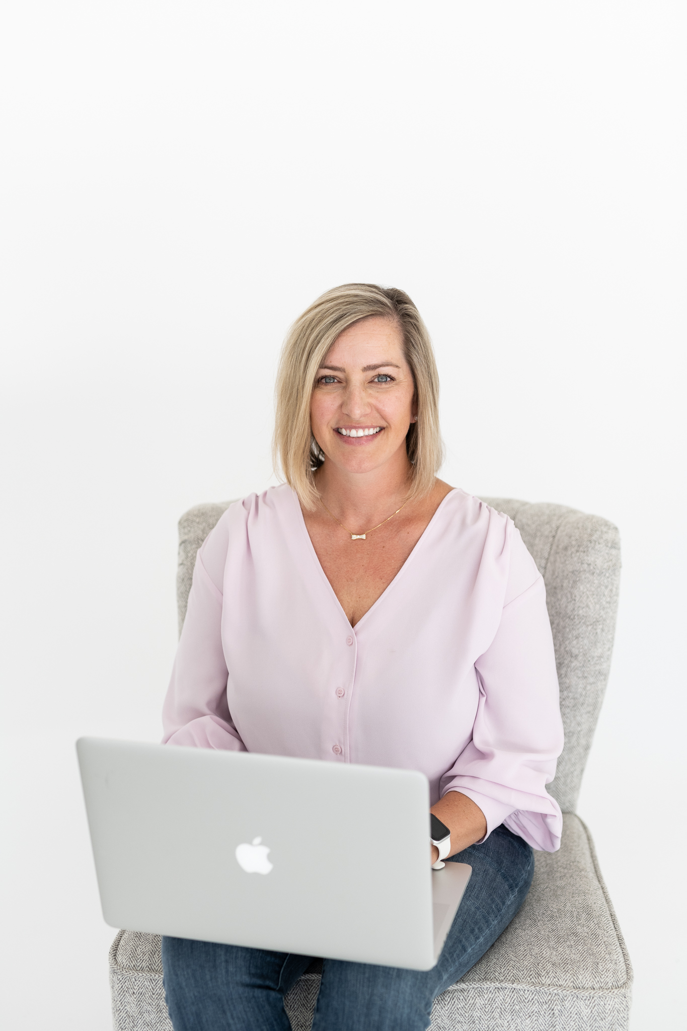 Nikki Shelley Nail, Realtor with Shelley Home Group, wearing a light pink blouse