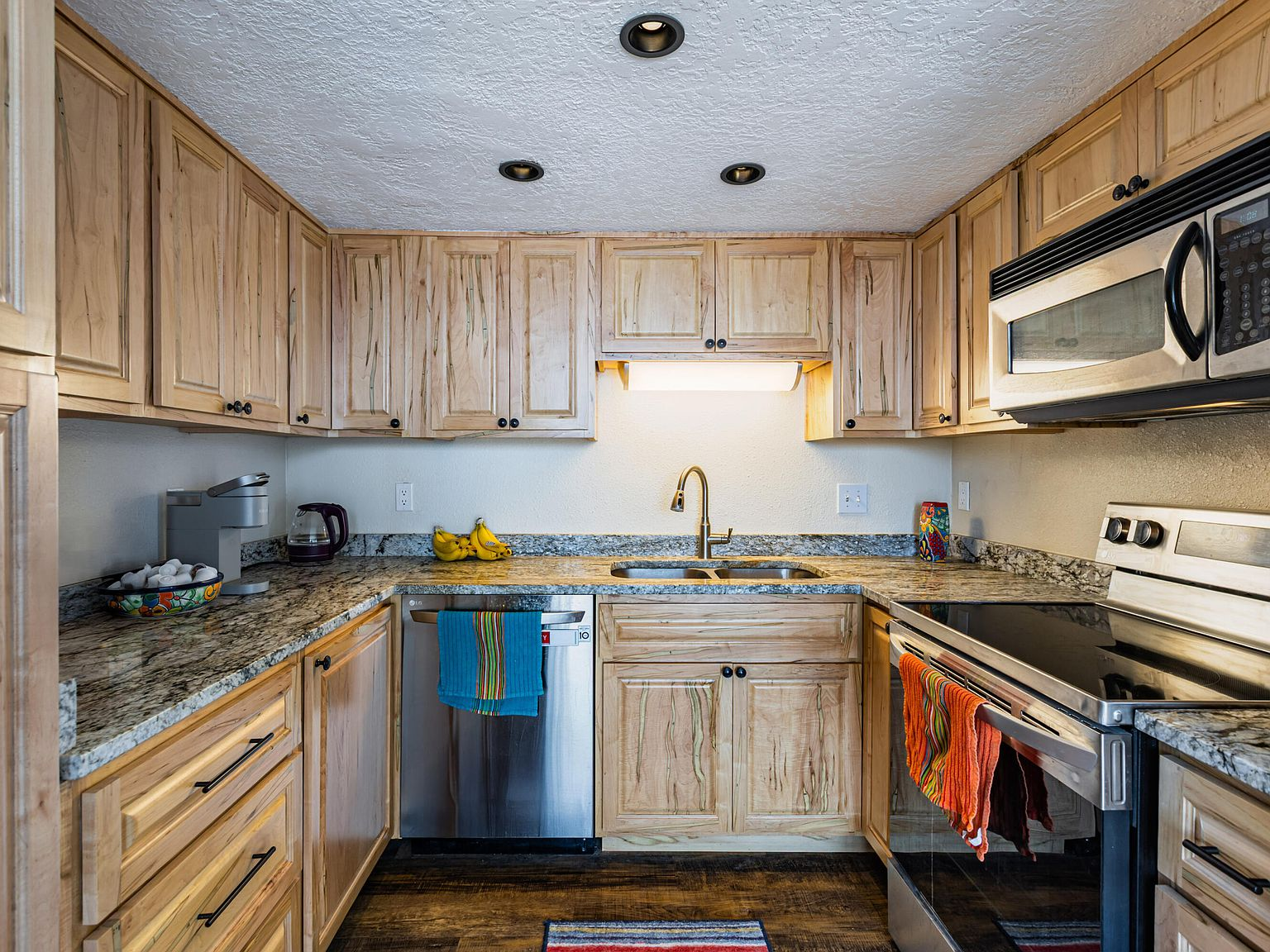 Galley kitchen with granite countertops