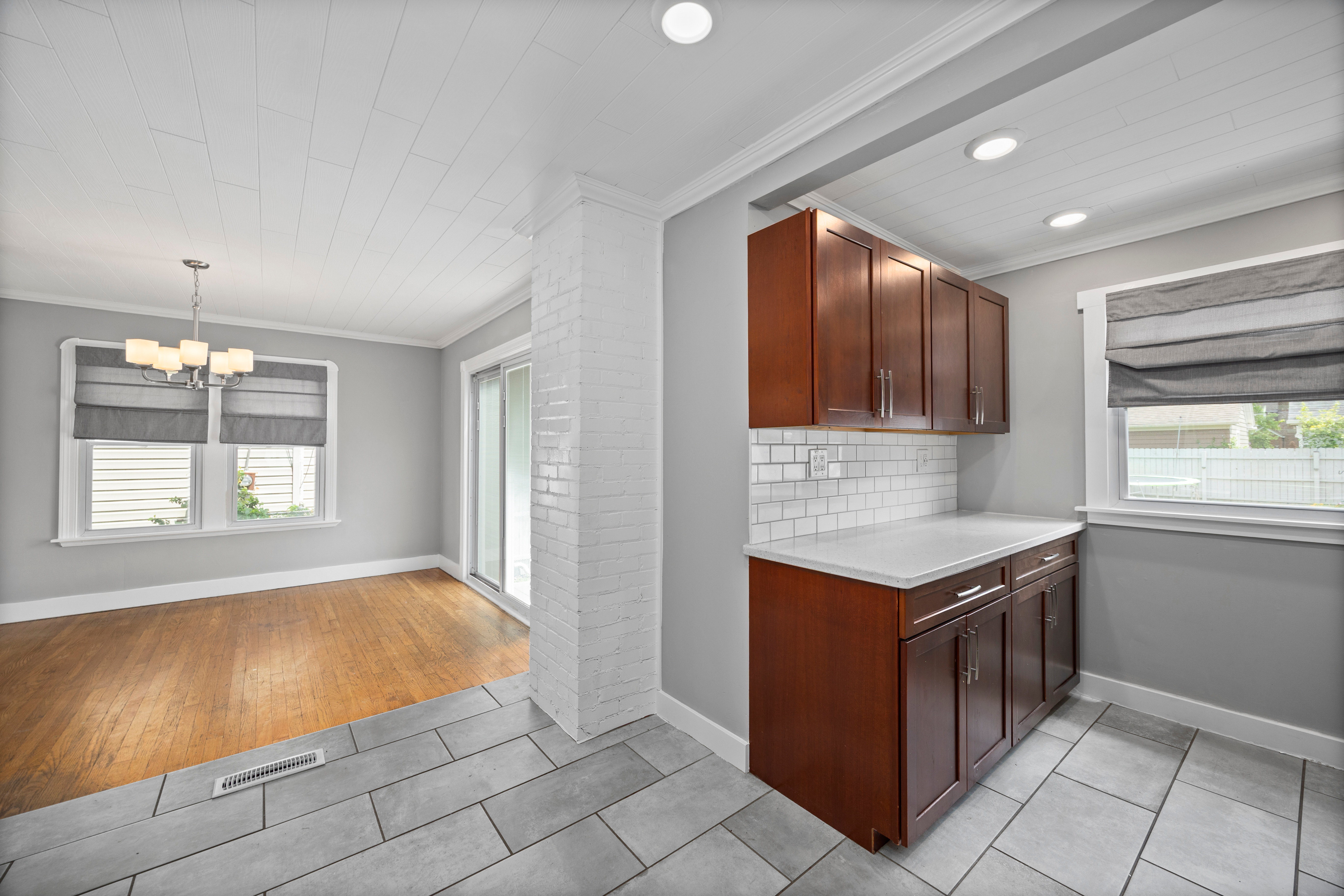 Kitchen and dining area at 337 Harvard Ave, hardwood meeting tile in the transition.