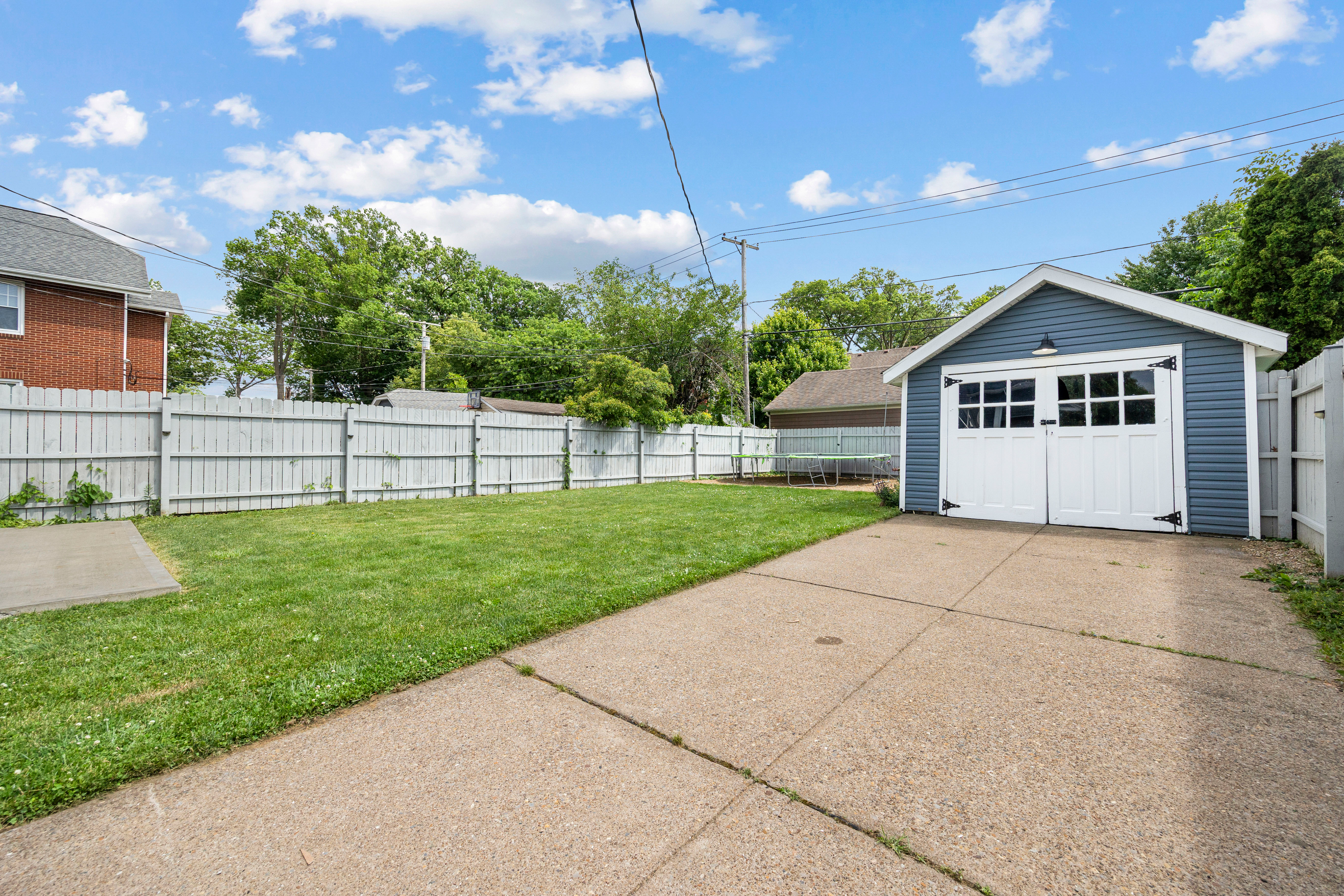 Detached one-car garage with carriage-style doors