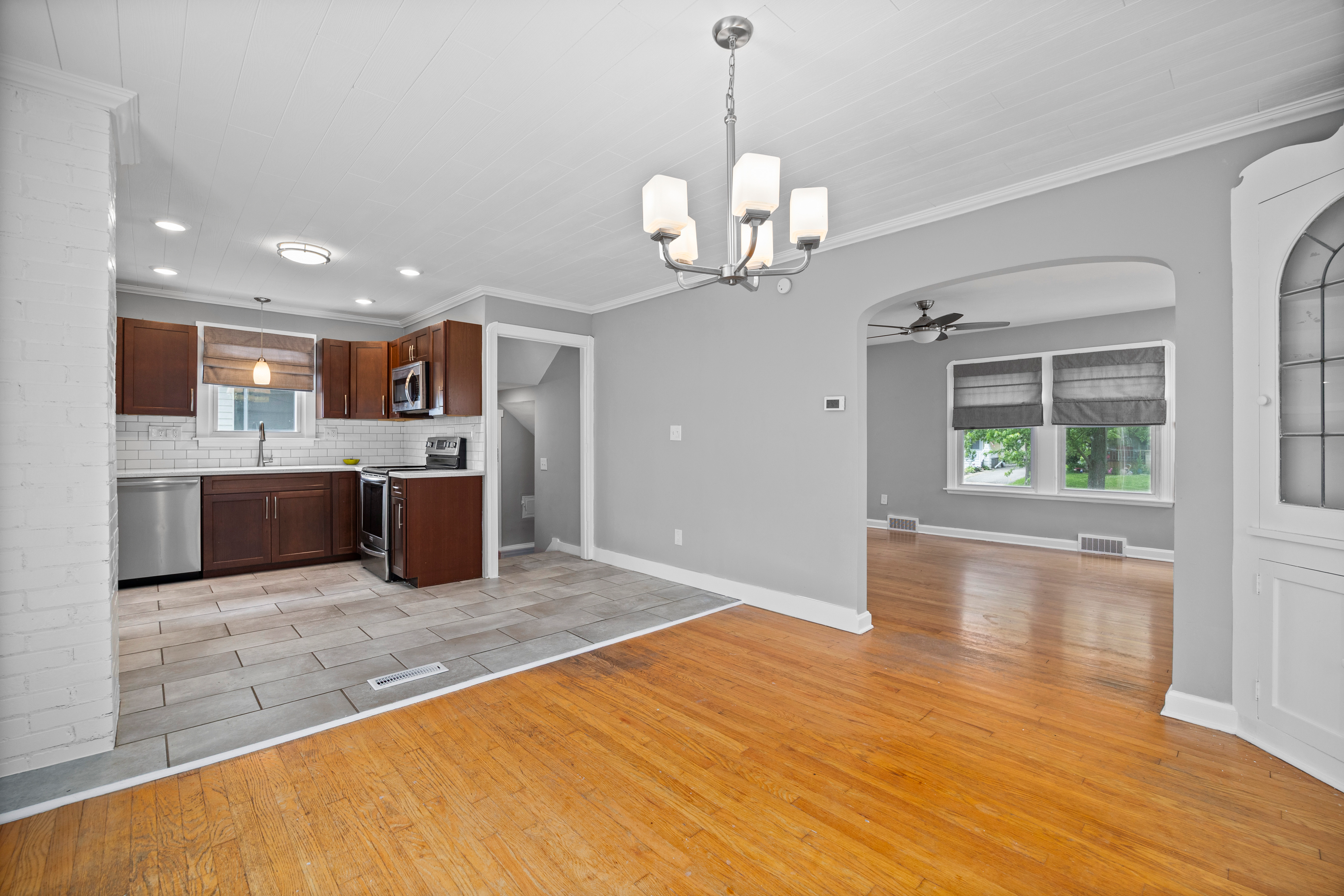 Kitchen-to-dining transition with tile meeting hardwood