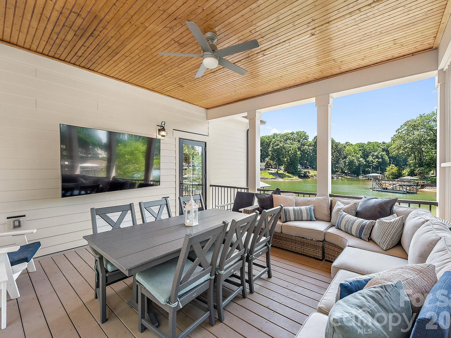 Covered outdoor deck with tongue-and-groove ceiling and lake views