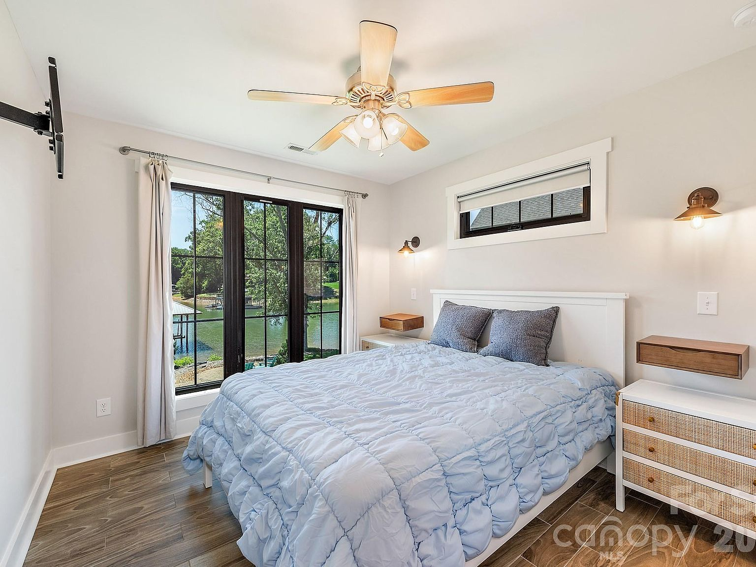 Bedroom with large French doors overlooking the lake