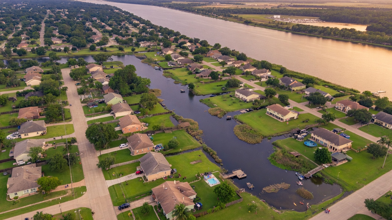 Aerial view of a Lake Houston area neighborhood with tree-lined streets and waterways in southeast Texas