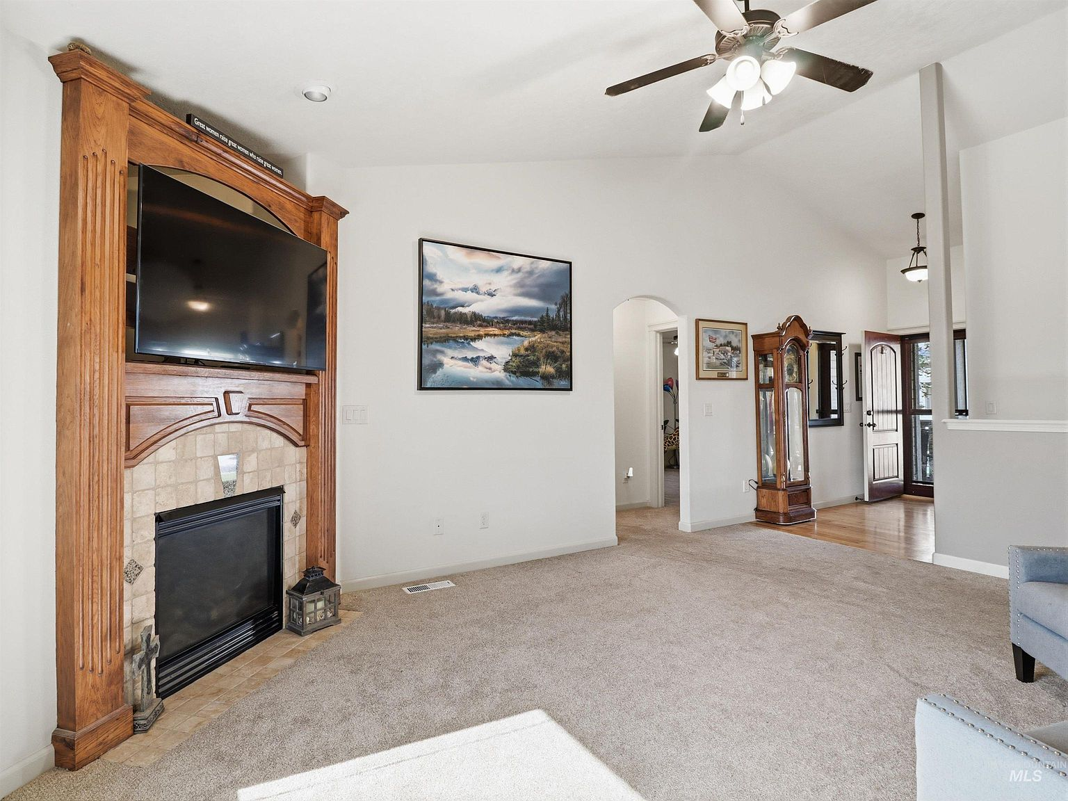 Vaulted living room with fireplace