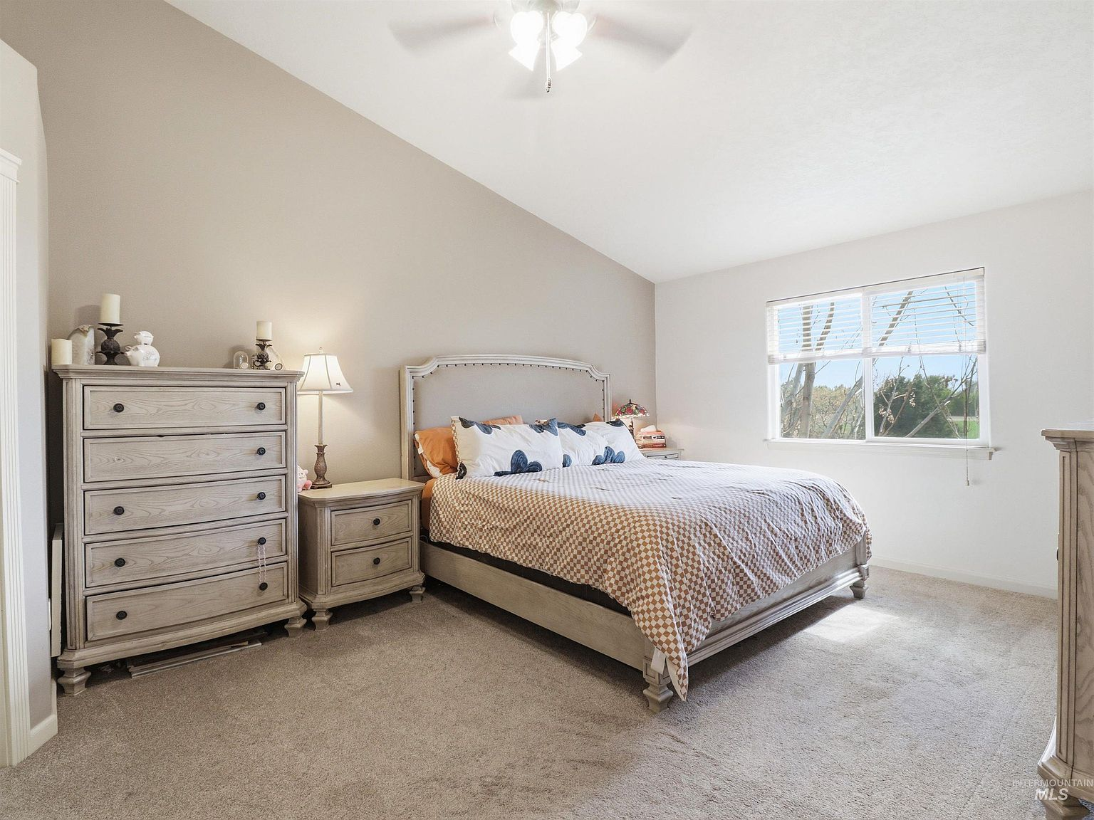 Spacious primary suite with vaulted ceiling