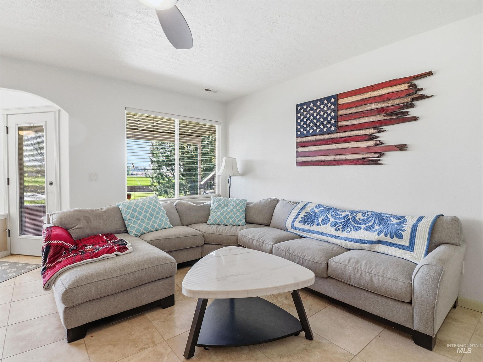 Living room with sectional and patio door
