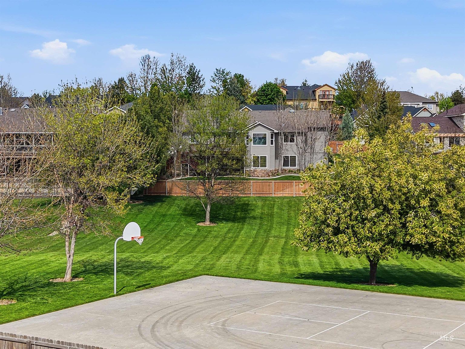 Basketball court adjacent to the backyard