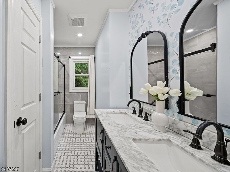 Updated bathroom with dual-sink vanity at 17 Ravine Ct Clifton NJ