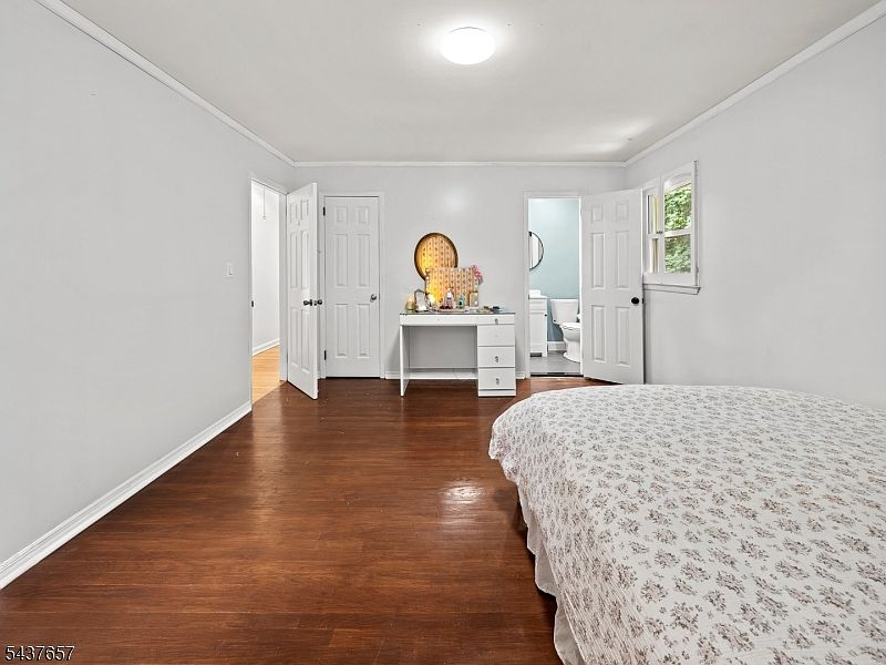 Primary bedroom with en-suite bathroom access
