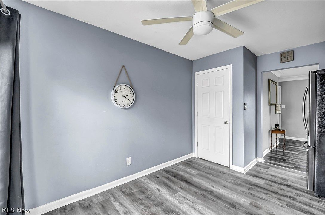 Kitchen dining area with grey walls and white trim