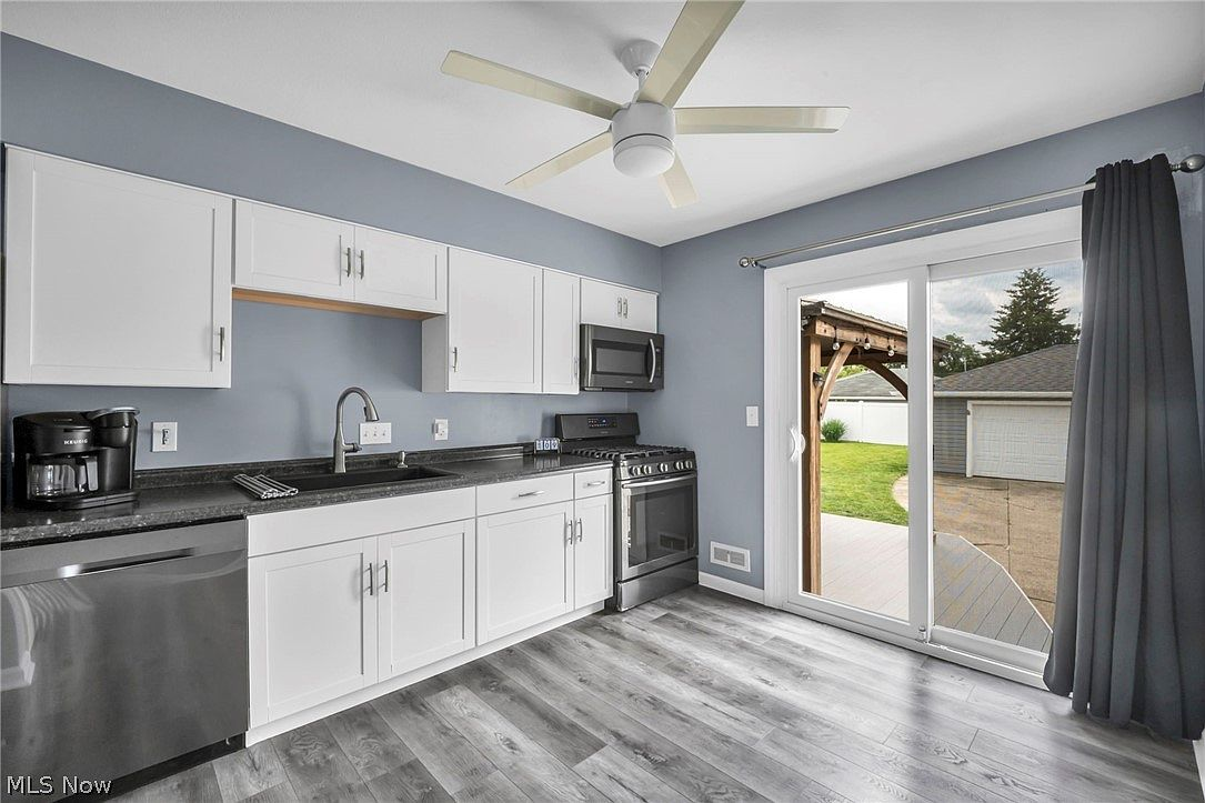 Kitchen with sliding glass door providing natural light