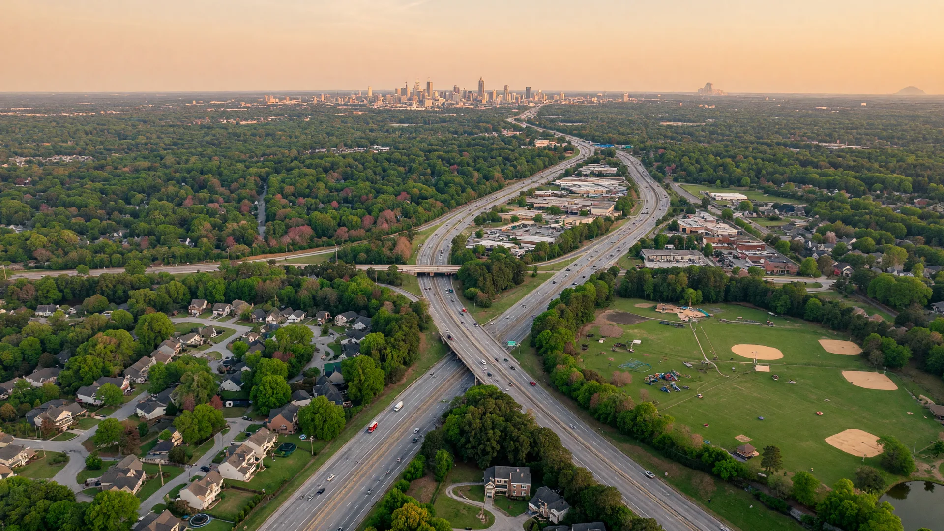 Aerial view of Stockbridge Georgia suburban neighborhoods and tree canopy
