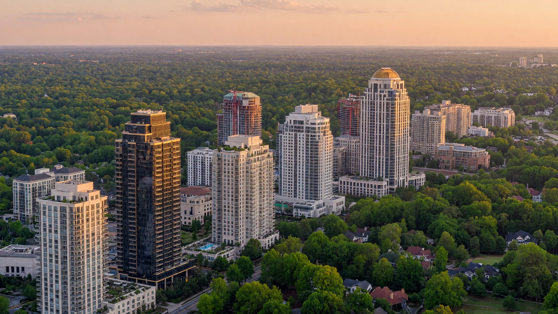 Buckhead Atlanta skyline with luxury high-rises and tree canopy at golden hour