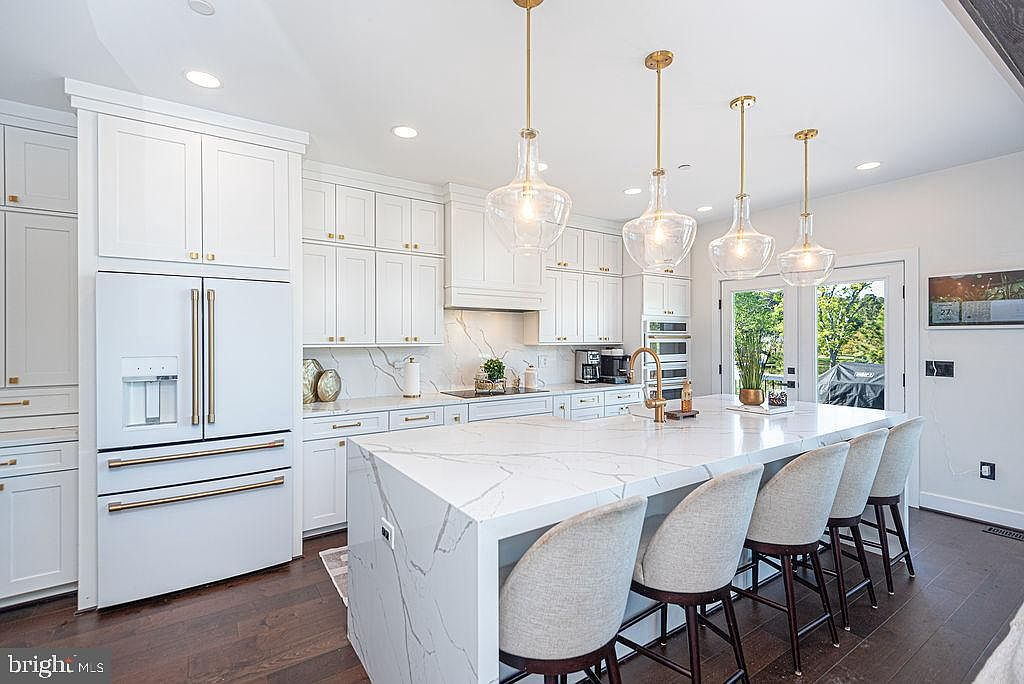 Chef kitchen with waterfall island and high-end Café appliances