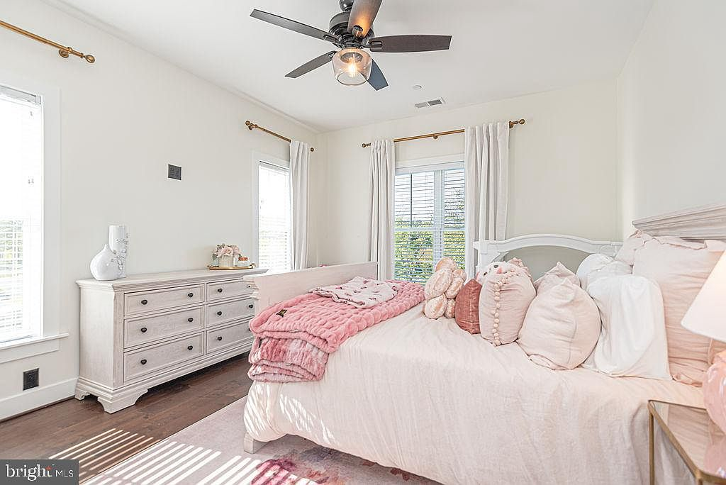 Guest bedroom with natural light and coastal finishes