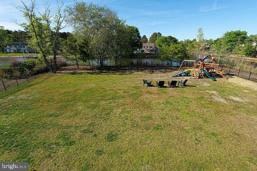 Fully fenced backyard with waterfront setting