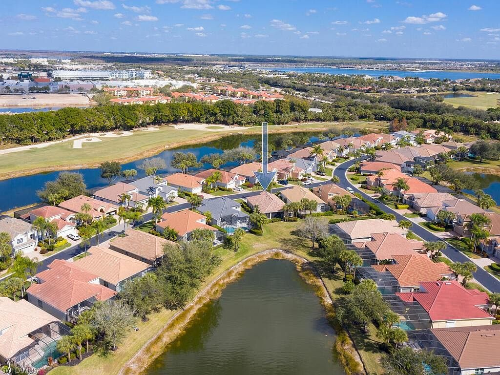 Aerial view of the Miromar Lakes community with waterways and golf course