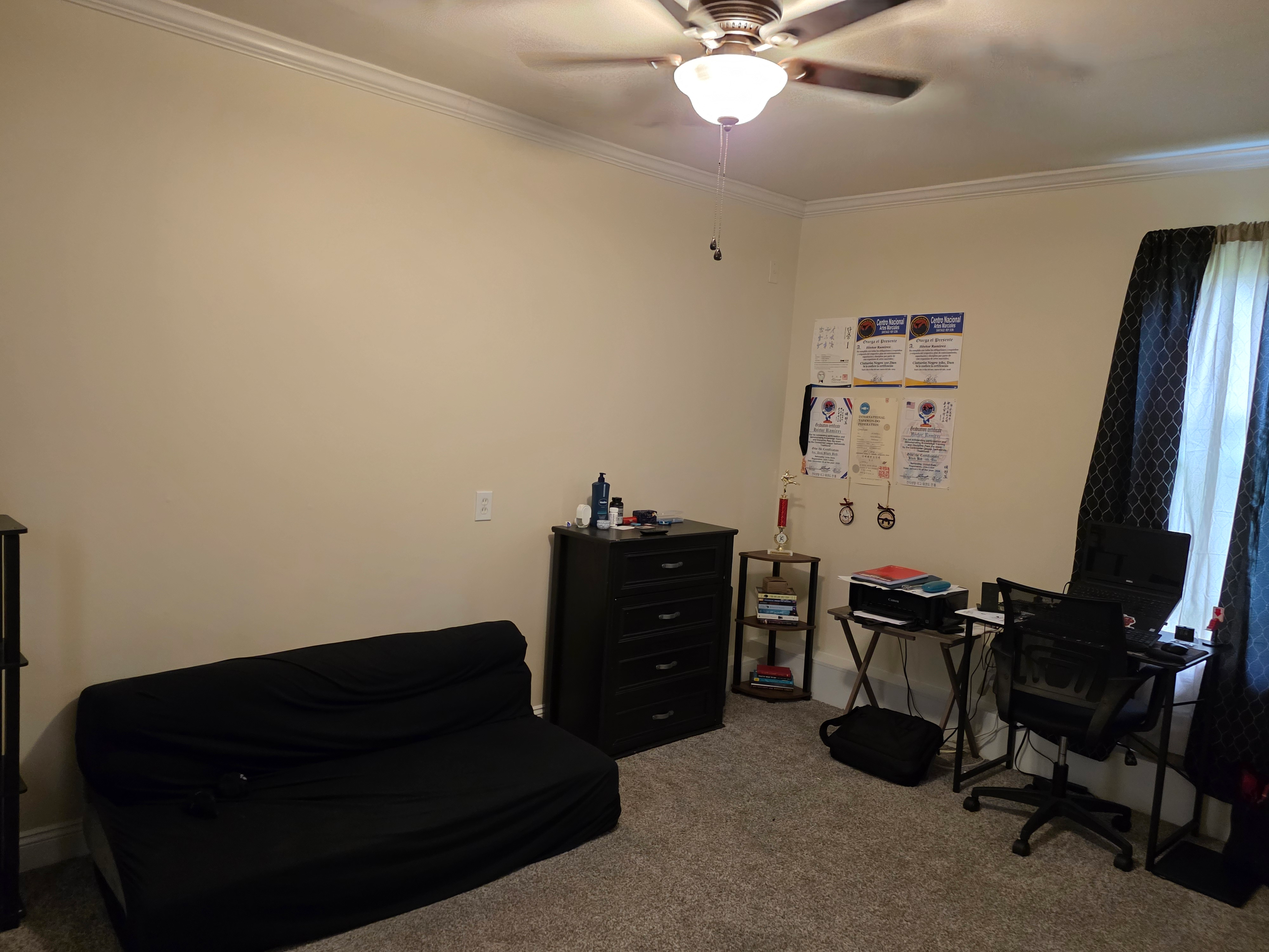 Versatile bedroom configured as a home office with crown molding